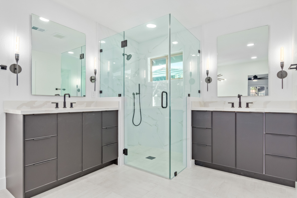 master bathroom with dark cabinets and corner shower photo