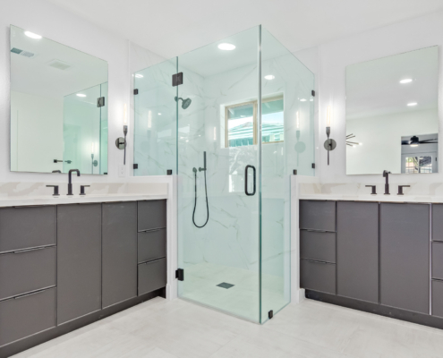master bathroom with dark cabinets and corner shower photo